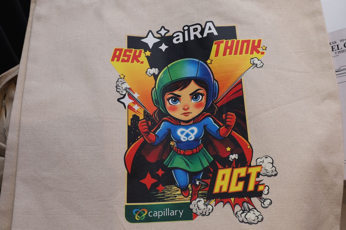 An aiRA tote bag printed with Ask, Think, Act