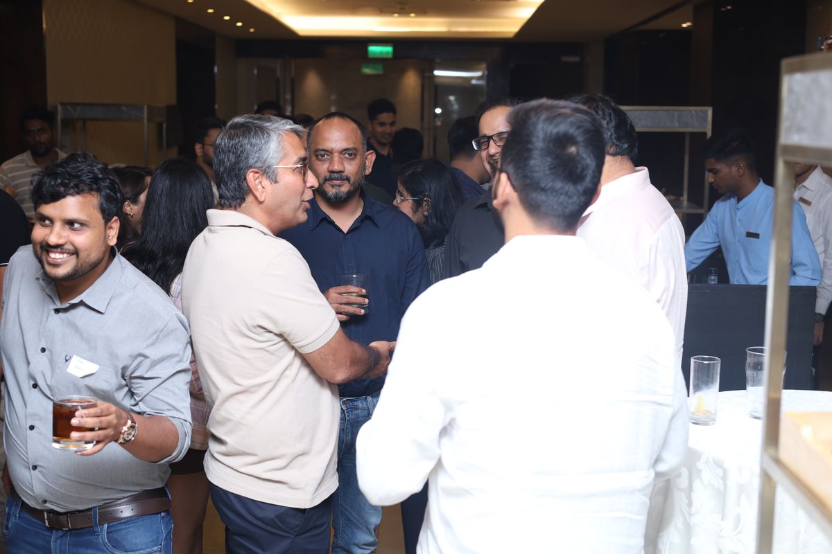 Attendees talking over dinner after the session