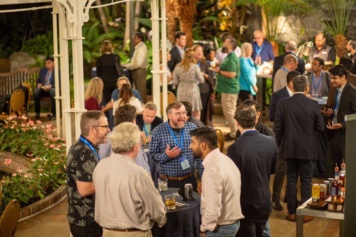 Attendees talking at the evening reception