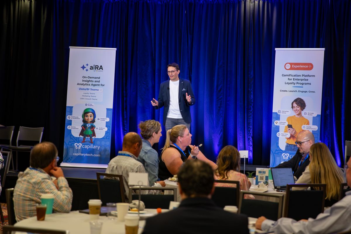 A speaker addressing the room from the Captivate stage